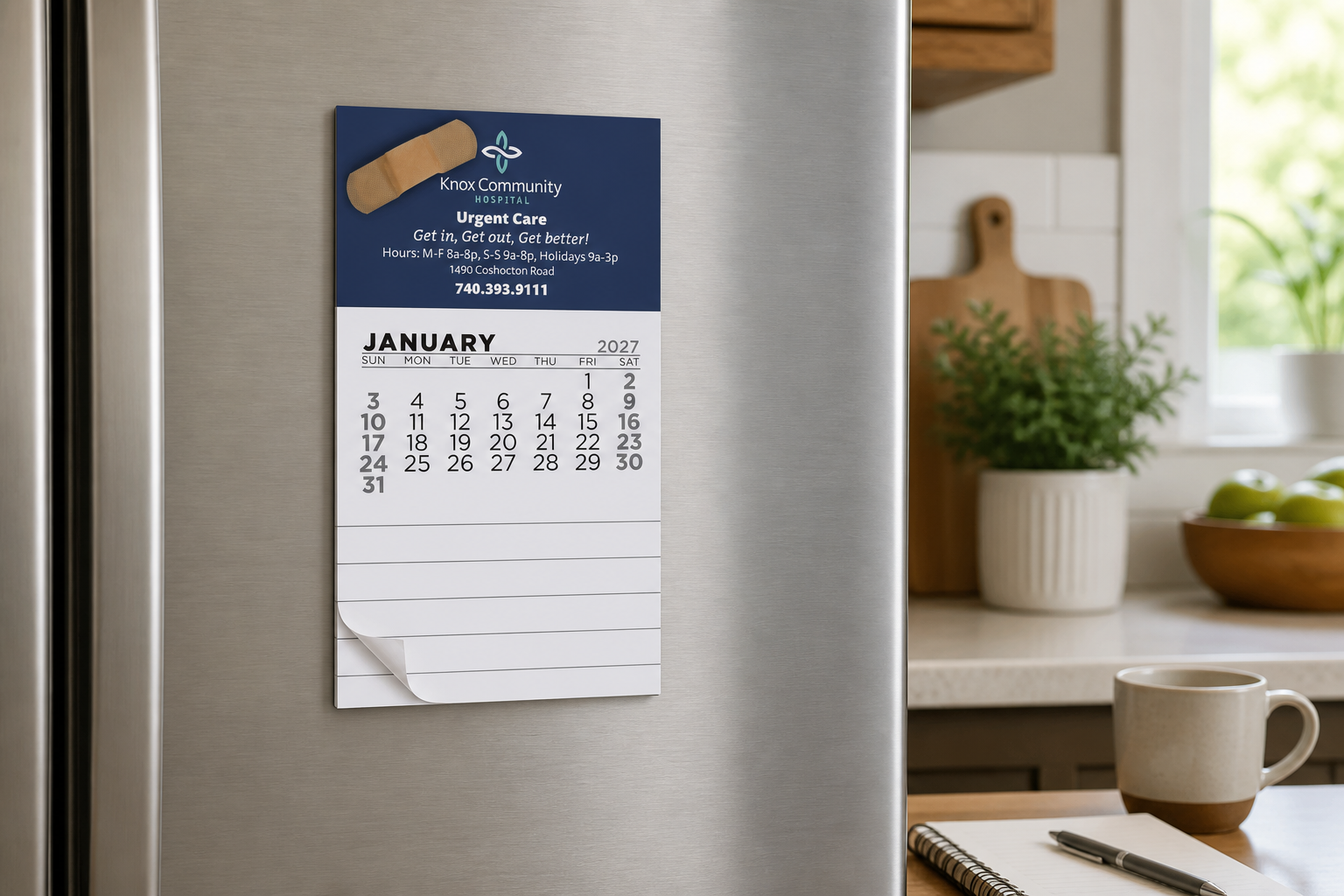 Add-A-Pad 12 Month Calendars displayed on a refrigerator in a bright home workspace